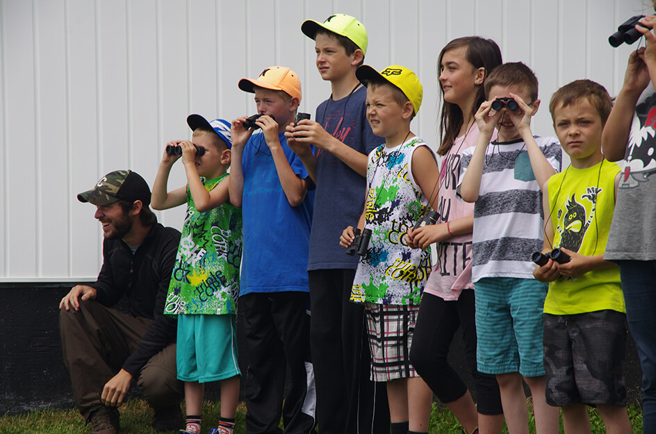 As part of an environmental education initiative for youth directed by Dr. Kathleen Blanchard, Connor Hedges assists in managing a bird count in Main Brook, Newfoundland, adjacent to the Hare Bay Islands Ecological Reserve.