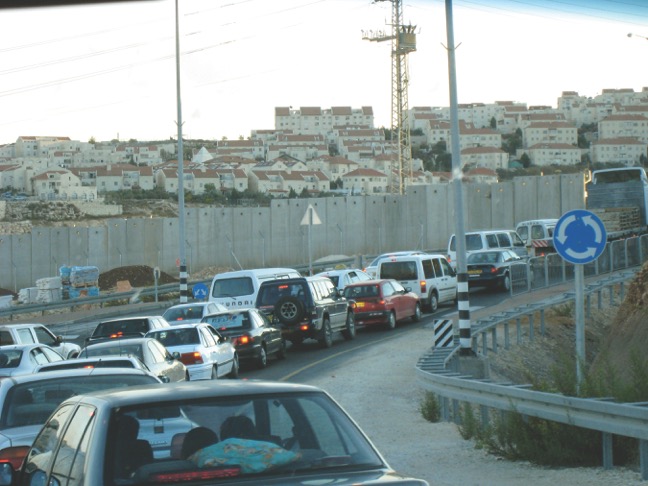 The Israeli-West Bank Separation Wall, West Bank, Palestine. In the background is the Israeli settlement of Giva’at Zae’ev (2007).